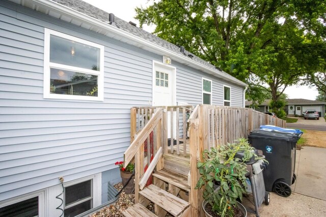 1109 Adams St, Mankato, MN 56001 - entrance to property featuring a deck and a shingled roof