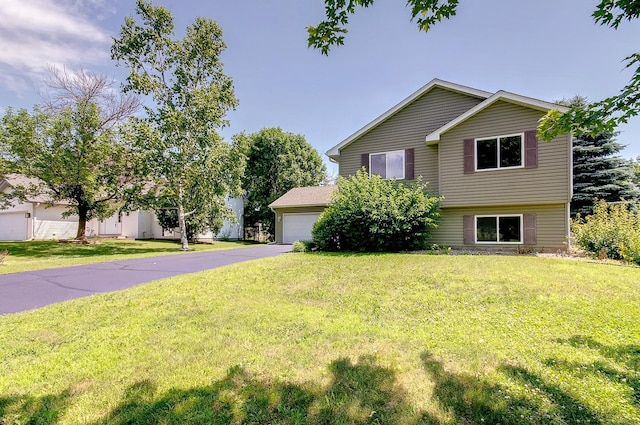 775 Leon St, Jordan, MN 55352 - view of front of house featuring a front lawn, driveway, and an attached garage