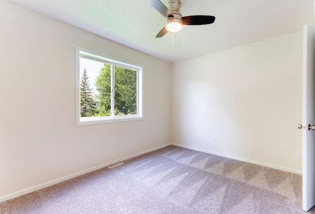 775 Leon St, Jordan, MN 55352 - carpeted spare room featuring baseboards and a ceiling fan
