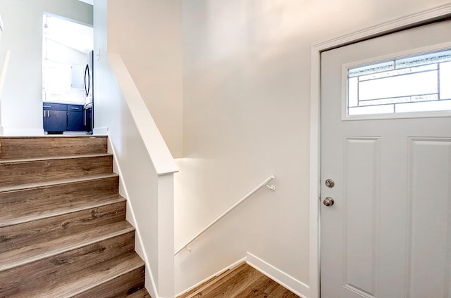 775 Leon St, Jordan, MN 55352 - stairs with wood finished floors and baseboards