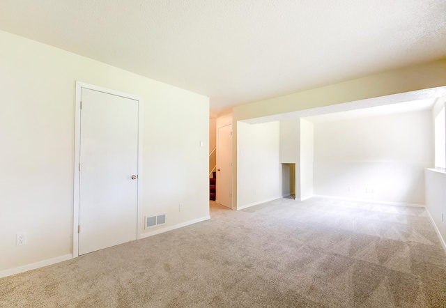 775 Leon St, Jordan, MN 55352 - carpeted spare room featuring baseboards and stairway
