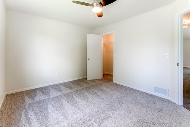 775 Leon St, Jordan, MN 55352 - unfurnished bedroom with carpet flooring, a spacious closet, and ceiling fan