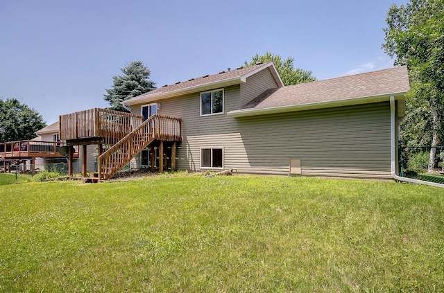 775 Leon St, Jordan, MN 55352 - back of property with a wooden deck, stairway, and a yard