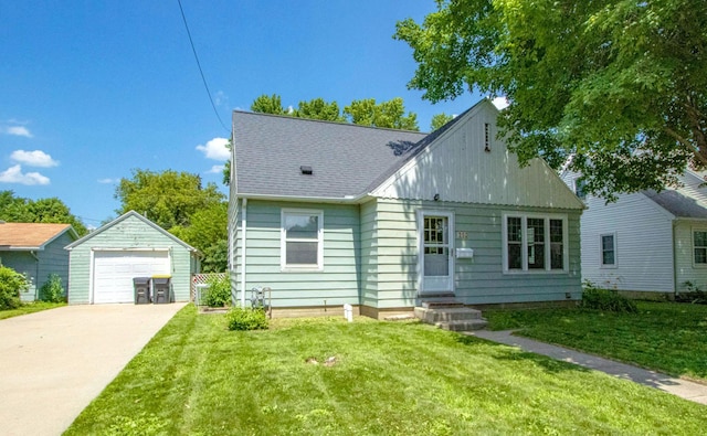 624 Garfield Ave, North Mankato, MN 56003 - view of front of house featuring an outbuilding, entry steps, a detached garage, and a front yard