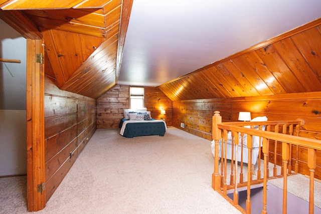 624 Garfield Ave, North Mankato, MN 56003 - bedroom with wood walls, carpet flooring, and vaulted ceiling