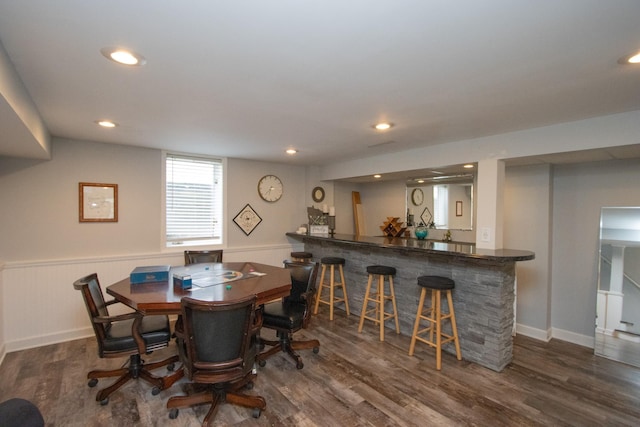 624 Garfield Ave, North Mankato, MN 56003 - dining area with bar with sink, wood finished floors, wainscoting, and recessed lighting
