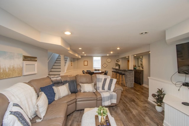 624 Garfield Ave, North Mankato, MN 56003 - living room featuring bar, stairs, dark wood-style flooring, and recessed lighting