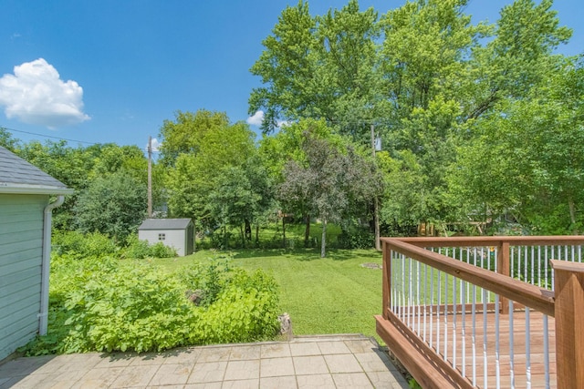 624 Garfield Ave, North Mankato, MN 56003 - view of grassy yard with a shed and a wooden deck