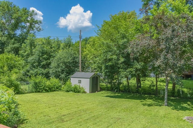 624 Garfield Ave, North Mankato, MN 56003 - fenced backyard featuring a storage shed