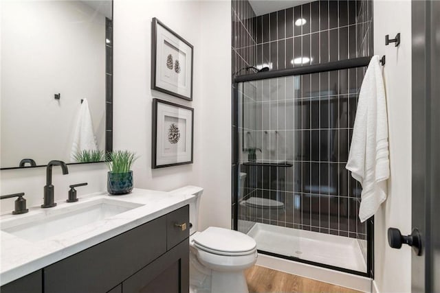 13975 27th St N, West Lakeland Twp, MN 55082 - full bathroom with vanity, a shower stall, and wood finished floors