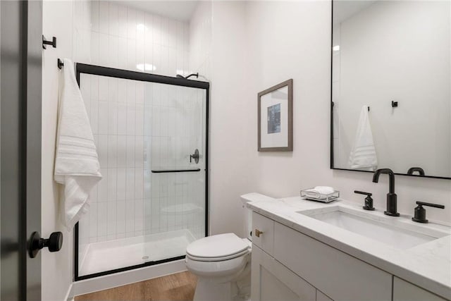 13975 27th St N, West Lakeland Twp, MN 55082 - bathroom with vanity, a stall shower, and wood finished floors