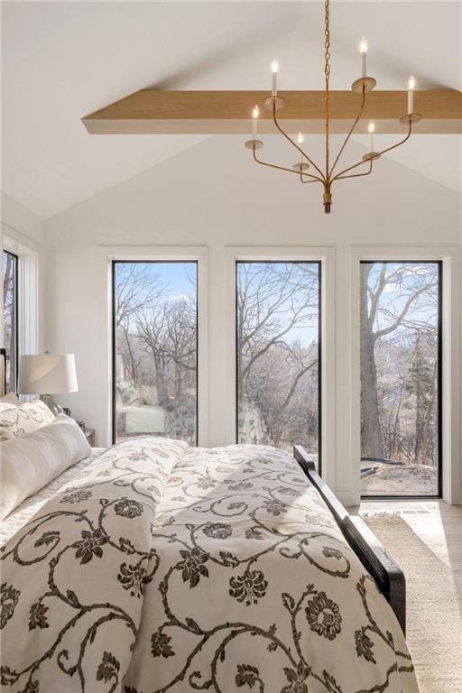 13975 27th St N, West Lakeland Twp, MN 55082 - bedroom with access to outside, multiple windows, and a chandelier