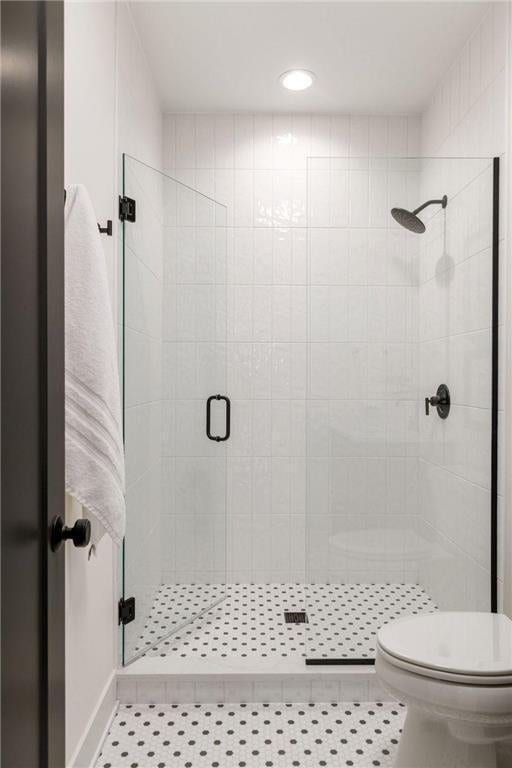13975 27th St N, West Lakeland Twp, MN 55082 - bathroom featuring a stall shower, recessed lighting, and tile patterned floors
