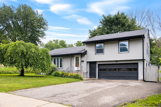 117 Division St, Mankato, MN 56001 - tri-level home with a garage, driveway, and roof with shingles