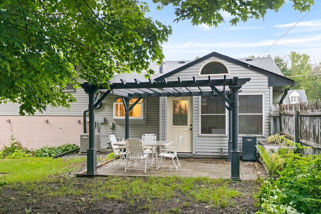 117 Division St, Mankato, MN 56001 - back of house featuring a pergola, a patio, and a shingled roof