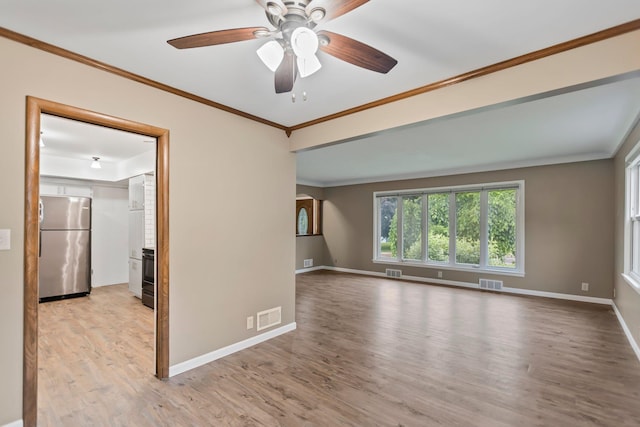 117 Division St, Mankato, MN 56001 - unfurnished room featuring light wood finished floors, a ceiling fan, and ornamental molding