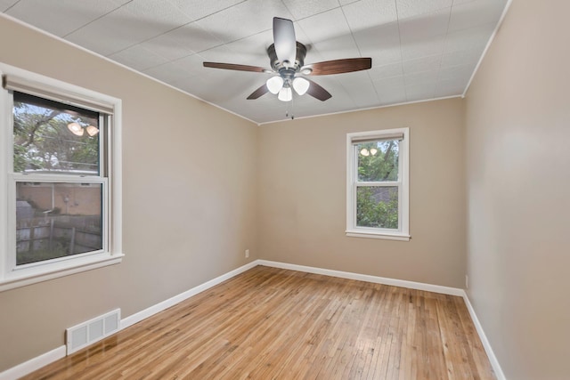 117 Division St, Mankato, MN 56001 - unfurnished room featuring hardwood / wood-style flooring, ceiling fan, and crown molding