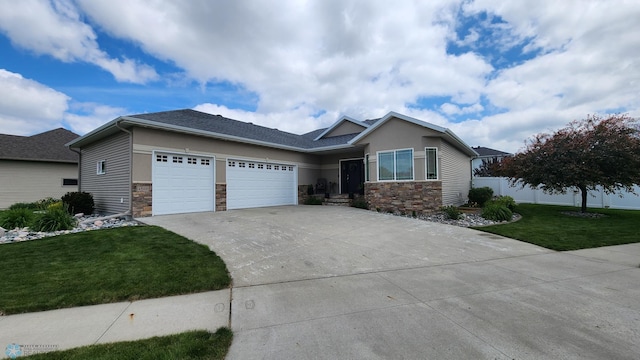 4508 Beach Ln S, Fargo, ND 58104 - ranch-style home with stone siding, concrete driveway, and an attached garage