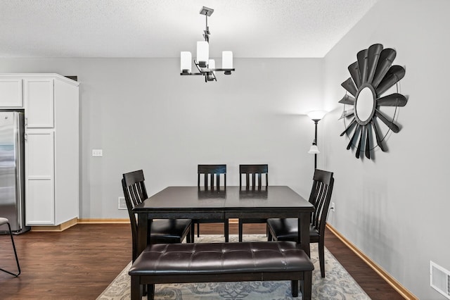13433 Brick Path, Rosemount, MN 55068 - dining area with a chandelier, dark wood-style floors, and a textured ceiling