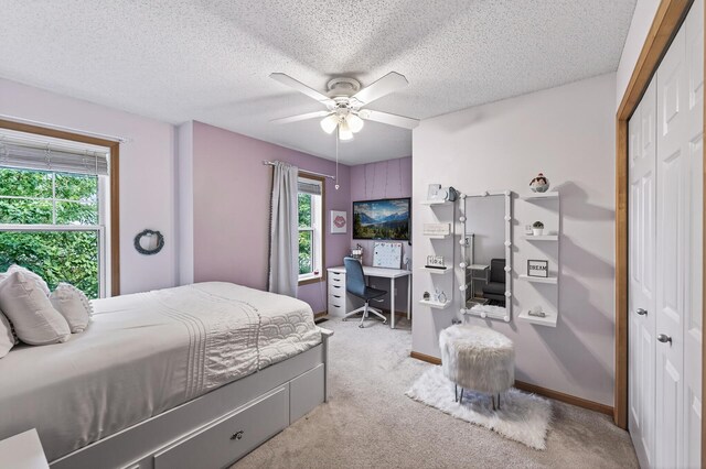 13433 Brick Path, Rosemount, MN 55068 - bedroom with an office area, light colored carpet, a closet, a textured ceiling, and a ceiling fan