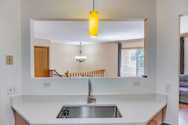 7639 Nicholas Way, Chanhassen, MN 55317 - kitchen with hanging light fixtures, a textured ceiling, and a chandelier