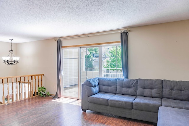 7639 Nicholas Way, Chanhassen, MN 55317 - living area featuring a chandelier, wood finished floors, and a textured ceiling