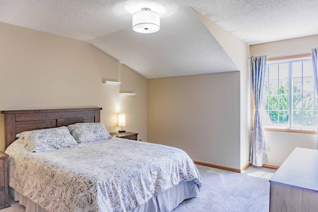7639 Nicholas Way, Chanhassen, MN 55317 - bedroom featuring light colored carpet, a textured ceiling, and vaulted ceiling