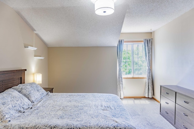 7639 Nicholas Way, Chanhassen, MN 55317 - carpeted bedroom with a textured ceiling and lofted ceiling
