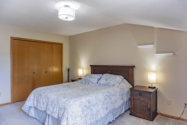 7639 Nicholas Way, Chanhassen, MN 55317 - bedroom with light carpet, a closet, and vaulted ceiling