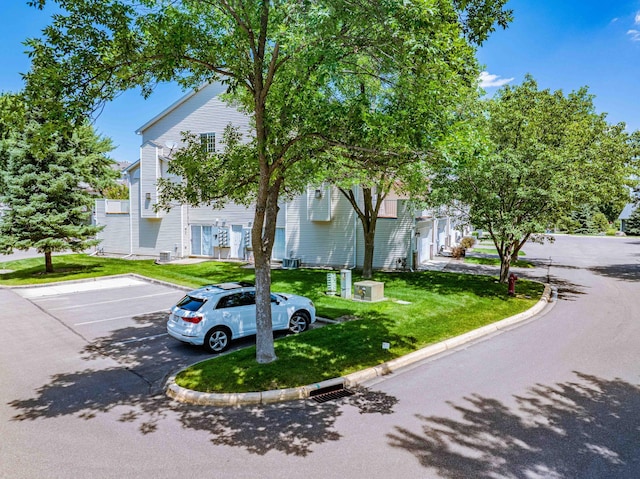 7639 Nicholas Way, Chanhassen, MN 55317 - view of front of house featuring uncovered parking and a front yard
