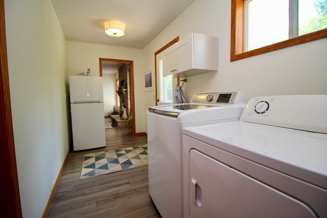 11715 Sorenson Lake Rd, Merrifield, MN 56465 - laundry room with washer and clothes dryer and dark wood-style flooring