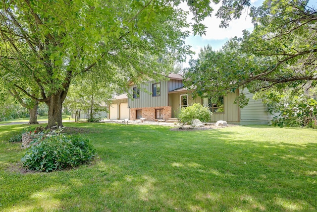 7771 Odean Ave NE, Otsego, MN 55330 - view of grassy yard featuring an attached garage