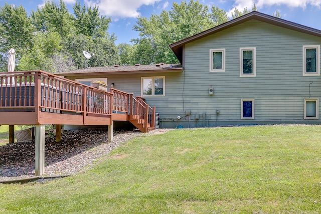 7771 Odean Ave NE, Otsego, MN 55330 - rear view of property featuring a deck and a lawn