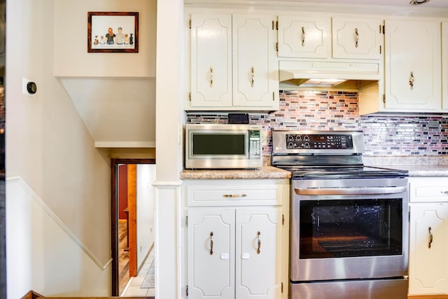 7771 Odean Ave NE, Otsego, MN 55330 - kitchen with stainless steel appliances, tasteful backsplash, white cabinets, extractor fan, and light countertops