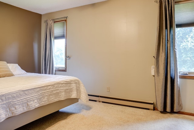 7771 Odean Ave NE, Otsego, MN 55330 - bedroom with a baseboard radiator, carpet floors, and multiple windows