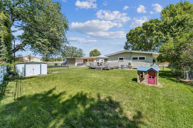 1073 Allen Ave W, Saint Paul, MN 55118 - view of yard featuring a storage unit and a deck