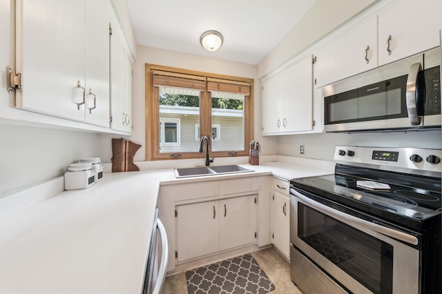 1073 Allen Ave W, Saint Paul, MN 55118 - kitchen with stainless steel appliances, light countertops, and white cabinets