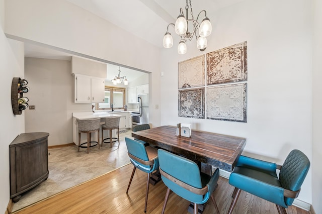 1073 Allen Ave W, Saint Paul, MN 55118 - dining area with a chandelier and light wood-style flooring