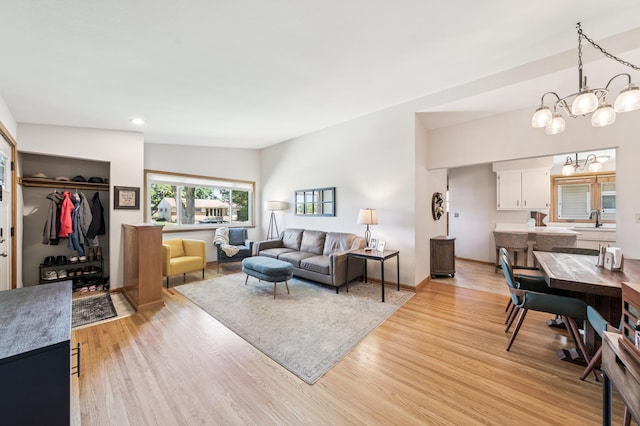 1073 Allen Ave W, Saint Paul, MN 55118 - living room featuring light wood-style floors, a chandelier, and recessed lighting