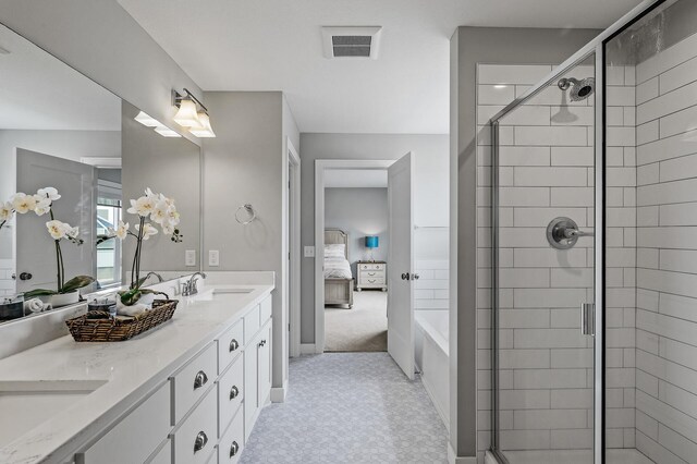 2301 Kester Ave NE, Saint Michael, MN 55376 - full bathroom featuring ensuite bath, double vanity, and a shower stall