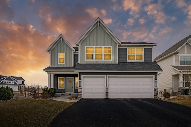 2301 Kester Ave NE, Saint Michael, MN 55376 - craftsman-style home with board and batten siding, driveway, an attached garage, stone siding, and a lawn