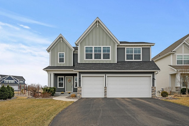 2301 Kester Ave NE, Saint Michael, MN 55376 - craftsman house with board and batten siding, a garage, driveway, and a front yard