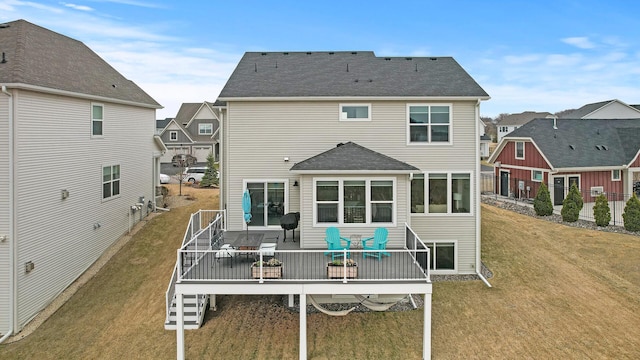 2301 Kester Ave NE, Saint Michael, MN 55376 - rear view of house featuring a wooden deck, a lawn, roof with shingles, a residential view, and outdoor dining space
