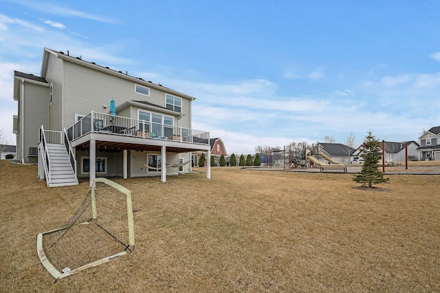 2301 Kester Ave NE, Saint Michael, MN 55376 - rear view of house with a wooden deck, a lawn, and stairway