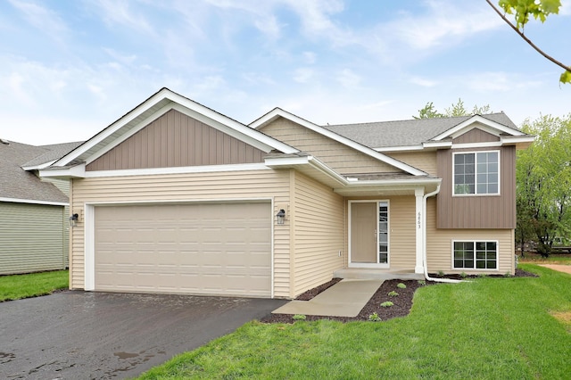 37554 Greenwich Ct, North Branch, MN 55056 - view of front of home with driveway, a garage, a front lawn, and a shingled roof