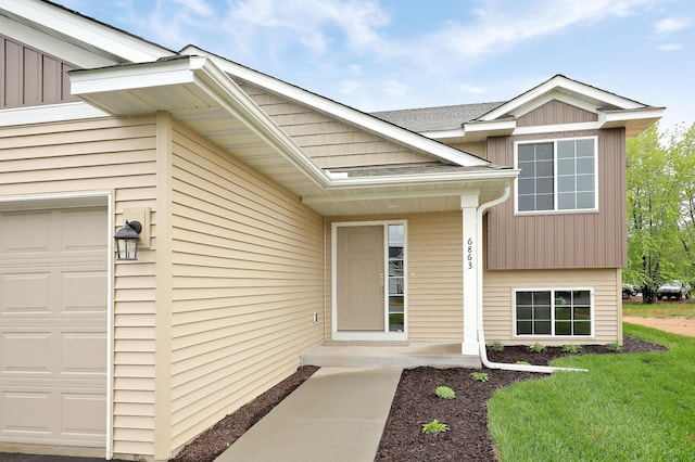 37554 Greenwich Ct, North Branch, MN 55056 - property entrance with an attached garage and a yard