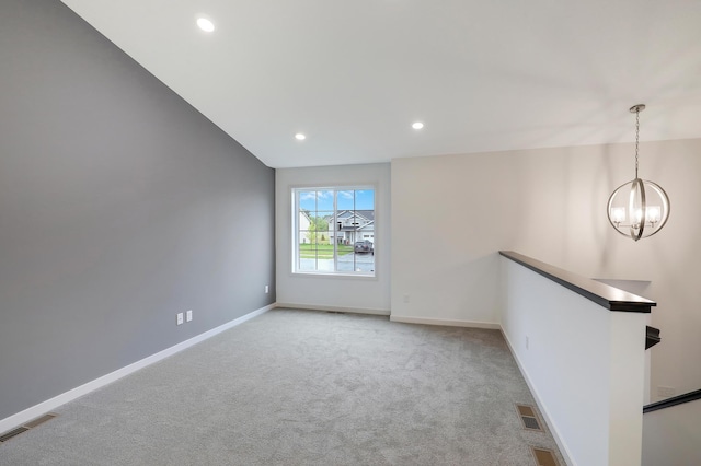 37554 Greenwich Ct, North Branch, MN 55056 - unfurnished room featuring a chandelier, light colored carpet, and recessed lighting