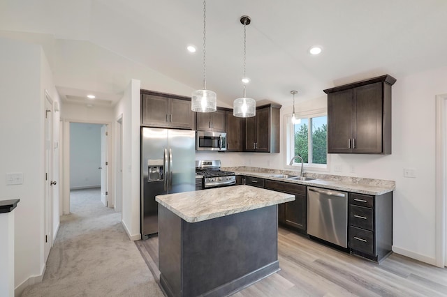 37554 Greenwich Ct, North Branch, MN 55056 - kitchen featuring stainless steel appliances, dark brown cabinets, light countertops, a kitchen island, and vaulted ceiling