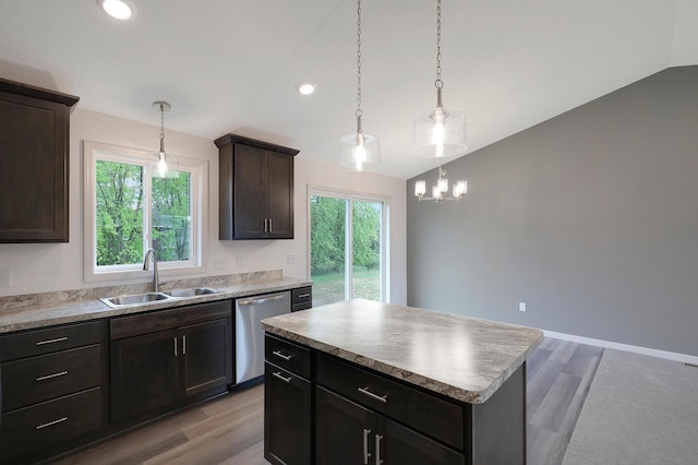 37554 Greenwich Ct, North Branch, MN 55056 - kitchen featuring stainless steel dishwasher, vaulted ceiling, a center island, light wood finished floors, and a chandelier