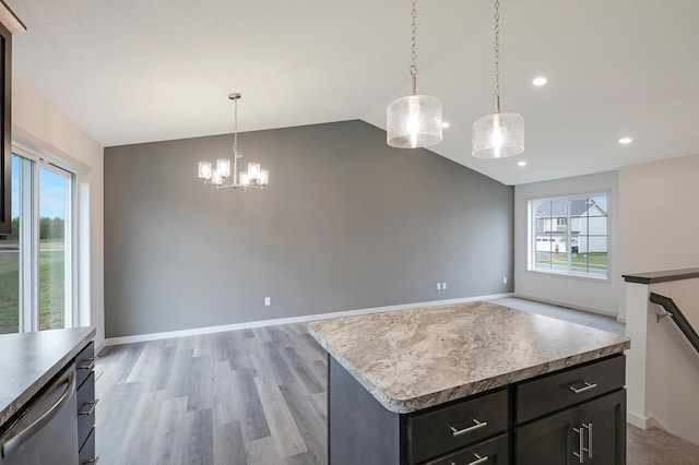 37554 Greenwich Ct, North Branch, MN 55056 - kitchen with healthy amount of natural light, vaulted ceiling, dishwasher, a chandelier, and hanging light fixtures